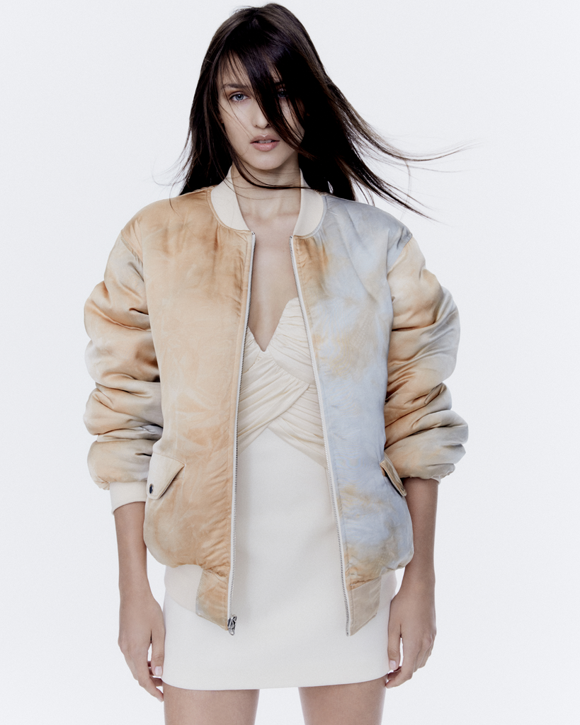 The Aziza Bomber in an oversized reversible bomber jacket, in an orange, cream tie-dye, featuring rib trim on the collar, cuffs and hem. The perfect summer jacket. By Auteur, now available at After Eight. 