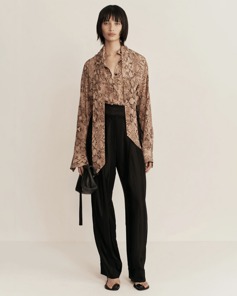 Introducing ESSE's sultry and textural in-house designed python print. A design detail which can be styled up for a polished look or unbuttoned and relaxed. This Shirt can we worn oversized, open or as a mini dress. By Esse, now available at After Eight. 