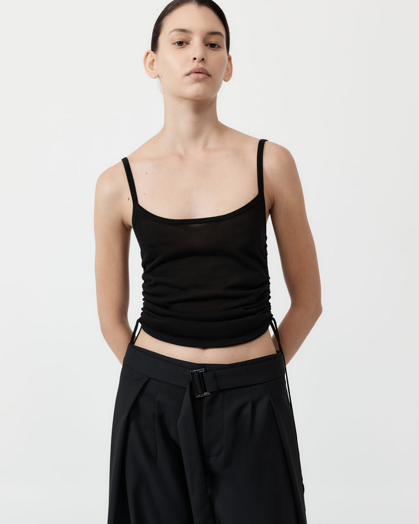 Reimagining the simple, everyday tank, the Ruched Tank has been crafted from a 100% TENCEL™ Lyocell knit for a semi-sheer fabrication. Boasting a scoop neckline, cami silhouette, ruched waist detail and an adjustable cropped length, the Ruched Tank was made for easy, everyday wear. By St Agni, now available at After Eight. 