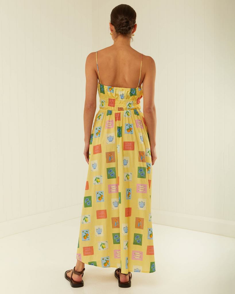 Destined to be a sunshine staple, the West Dress presents a fitted, elasticated waist, a floaty mid-length skirt and thin shoulder straps for easy wearing. Crafted in 100% Cotton Poplin in the hand-painted Yellow Emblem Print, the West will be a wardrobe favourite. By Palm Noosa, now available at After Eight. 