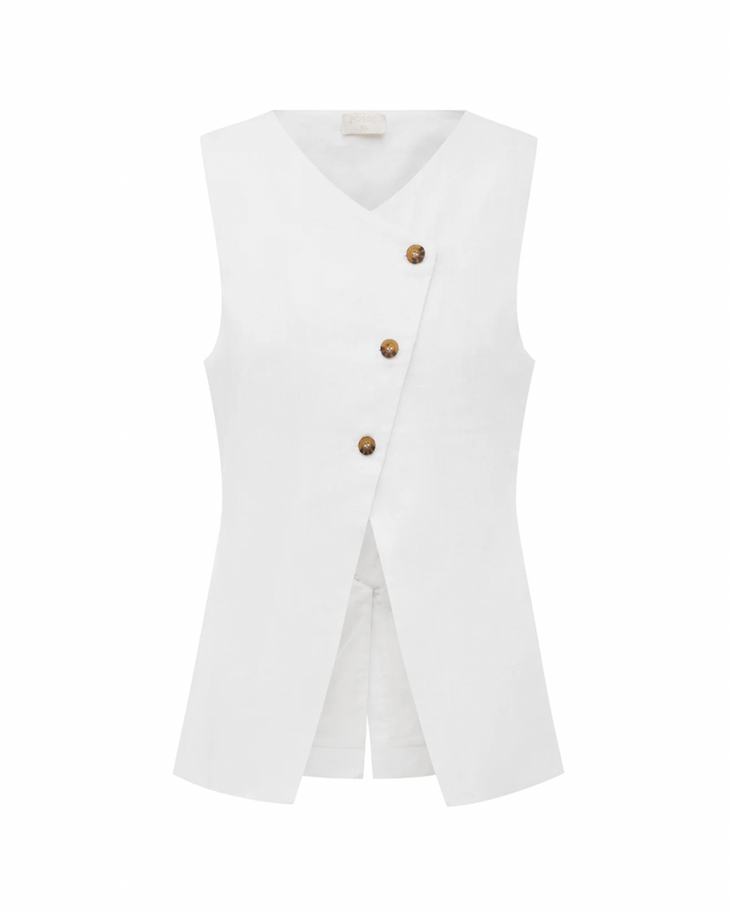 Classic and chic, the Gigi Gilet is a must-have piece for your staple wardrobe. Cut from certified linen, it features an elegant high neckline and statement front split. Style yours as a set with the coordinating Gigi Column Skirt. The crisp white hue makes it perfect for daytime events or a memorable bridal moment. By Posse, now available at After Eight. 