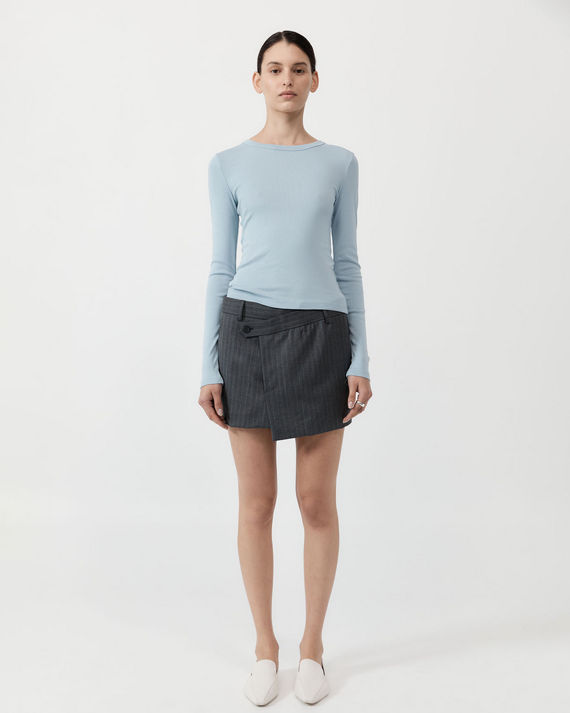 A slim-line minimalist staple, the Organic Cotton Long Sleeve Top boasts a crew neckline, long-sleeve silhouette and 100% organic cotton construction. Designed to layer seamlessly with your capsule wardrobe, the Organic Cotton Long Sleeve Top elevates a classic basic in both look and feel. By St Agni, now available at After Eight. 