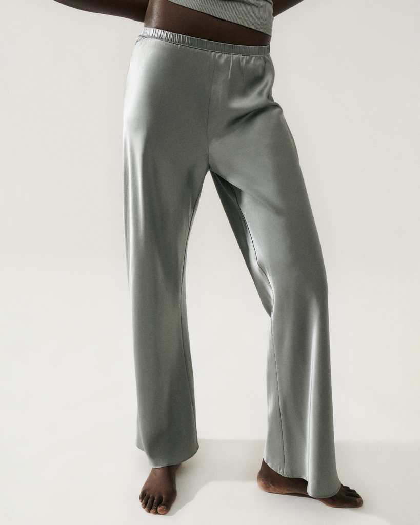 Silk Laundry pants crafted in 100% silk with a glossy finish. Cut on the bias to a regular fit, with an elasticated waistband that sits above the hip. By Silk Laundry, now available at After Eight. 