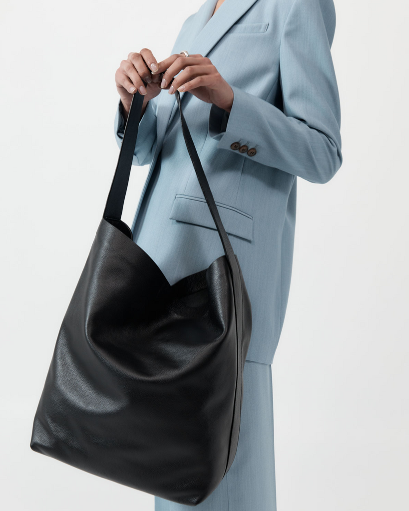 A nod to St Agni's origins, the Minimal Everyday Bag is a refined and unadorned everyday essential. Boasting a large body, minimalist silhouette and magnet closure, the Minimal Everyday Bag is a throw-on-and-go tote that's large enough to fit both work and play. By St Agni, now available at After Eight. 