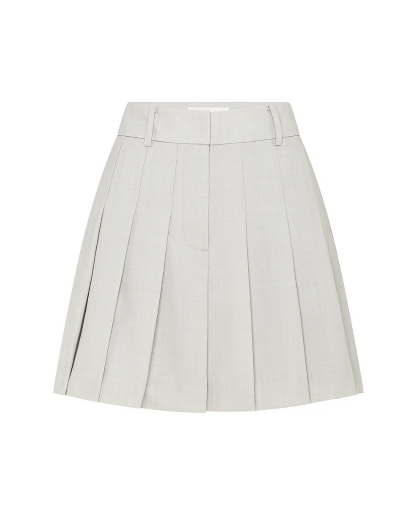 A nod to the best of the 90s. Combining tailored pleating with a modern wrap silhouette, this mini skirt is cut in Heather wool suiting for its smooth construction, featuring knife pleats and a front hook and bar zip closure. Style yours layered with a slouchy sweater or crisp shirt alike. By Anna Quan, now available at After Eight. 