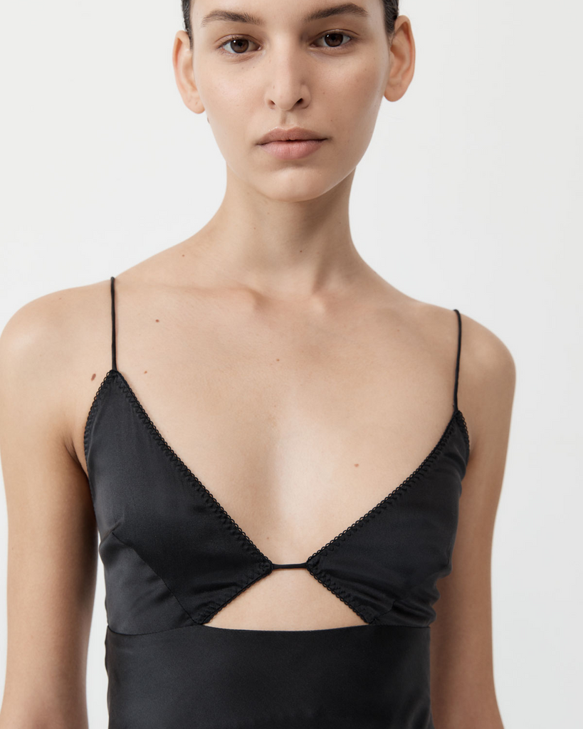 The Soft Silk Bra Bias Slip features a bra bodice, thin straps, bias cut, centre front cut-out, centre back bra fastening and maxi length. Crafted from a super-soft silk blend that cascades along the female form, the Soft Silk Bra Bias Slip is perfect for day-to-night styling. By St Agni, now available at After Eight. 