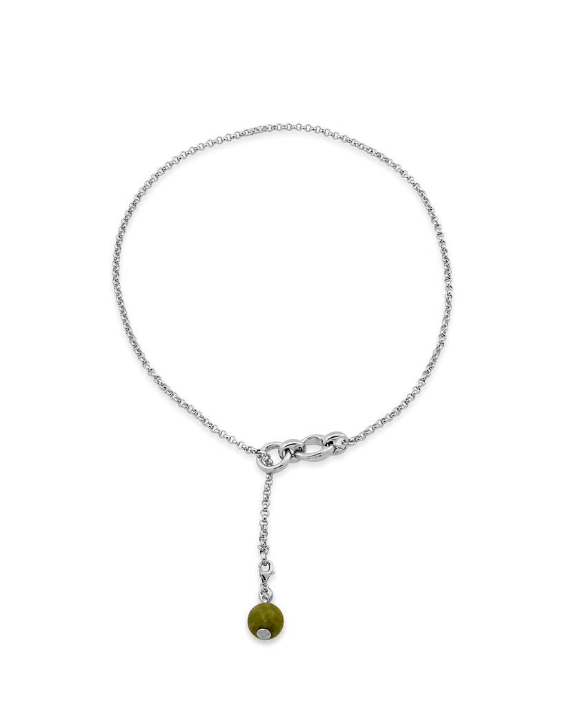 The Fob Necklace by Mineraleir is made from sterling silver plated with a silky rolo chain attaches to their signature links with a reclaimed vesuvianite sphere. By sustainable Australian brand Mineraleir.