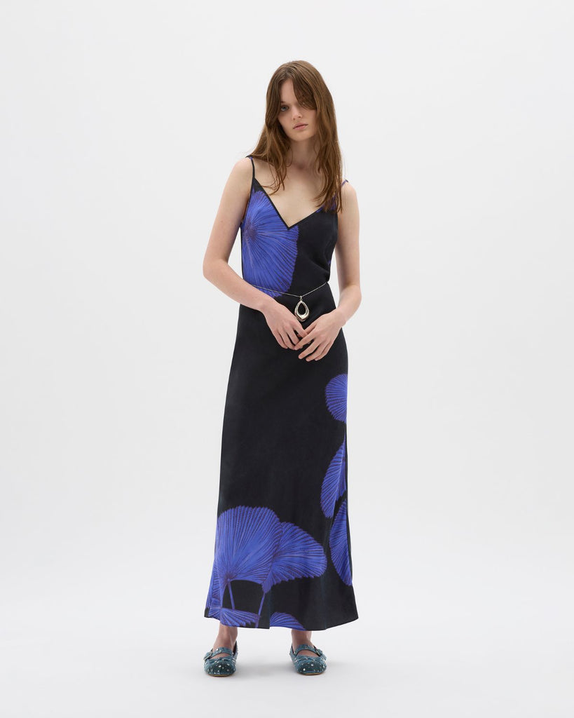 A timeless staple with a contemporary edge, the Yin Night Palms Bias Maxi dress is a seasonal favourite. Made in a lustrous, biodegradable vegan cupro exemplifying effortless style, its design ensures that it sits above the ephemeral trends of the decade. A gentle v at the neck and back, and bias in nature, a silhouette-defining piece. Adjustable straps and custom Muma hardware ensures it flatters any figure with ease. By Muma World, now available at After Eight. 