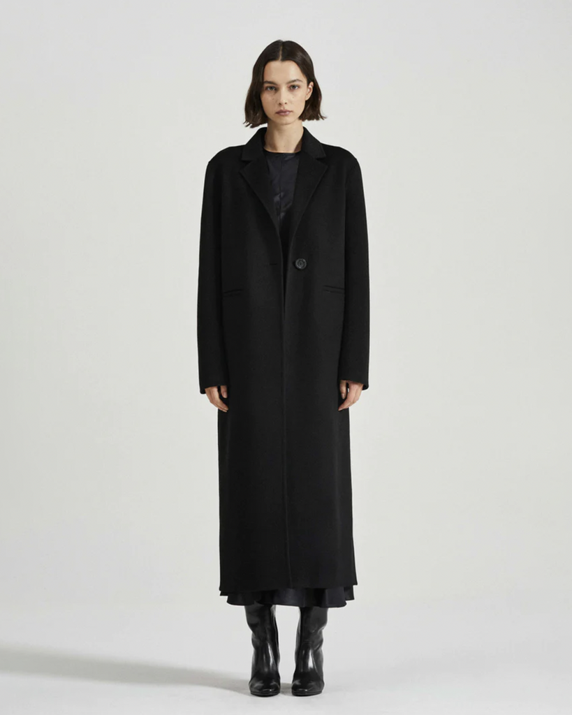 The Thomas Coat is the quintessential timeless tailored long-line coat you’ve been looking for. This longline coat features understated notch lapels, two front pockets and a single button closure. Beautiful craftsmanship and classic tailoring makes the Thomas Coat a must-have winter wardrobe piece. By Friends with Frank, now available at After Eight. 
