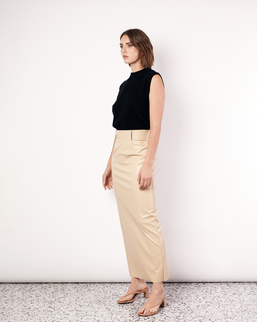 The best selling, Maxi Suiting Skirt has been recut for Fall in a buttery soft vegan leather. It features belt loops and a back split for ease of wear. By Romy, now available at After Eight. 