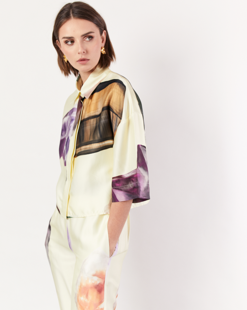 The Gemstone Cropped Shirt features a button closure and concealed placket, in a cropped edition of the best-selling signature shirt style. It is crafted from a silky recycled Oeko-Tex® certified viscose in the opulent Gemstone Print, designed exclusively for Romy. By Romy, now available at After Eight.