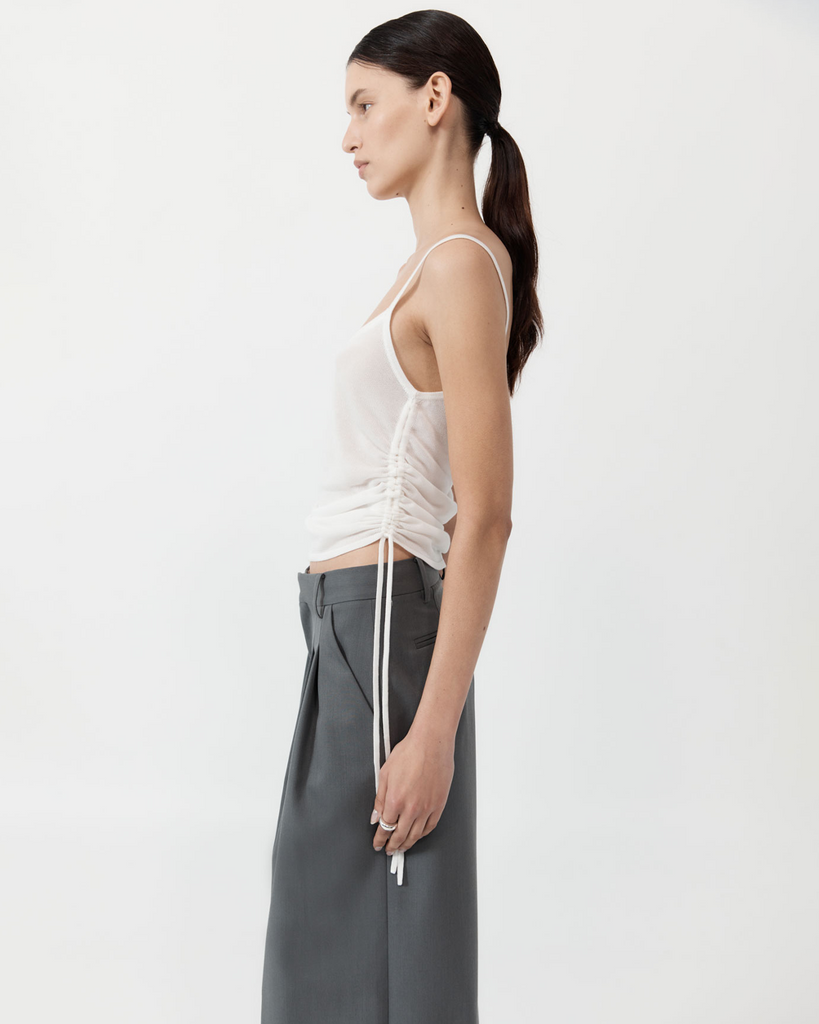 Reimagining the simple, everyday tank, the Ruched Tank has been crafted from a 100% TENCEL™ Lyocell knit for a semi-sheer fabrication. Boasting a scoop neckline, cami silhouette, ruched waist detail and an adjustable cropped length, the Ruched Tank was made for easy, everyday wear. By St Agni, now available at After Eight. 