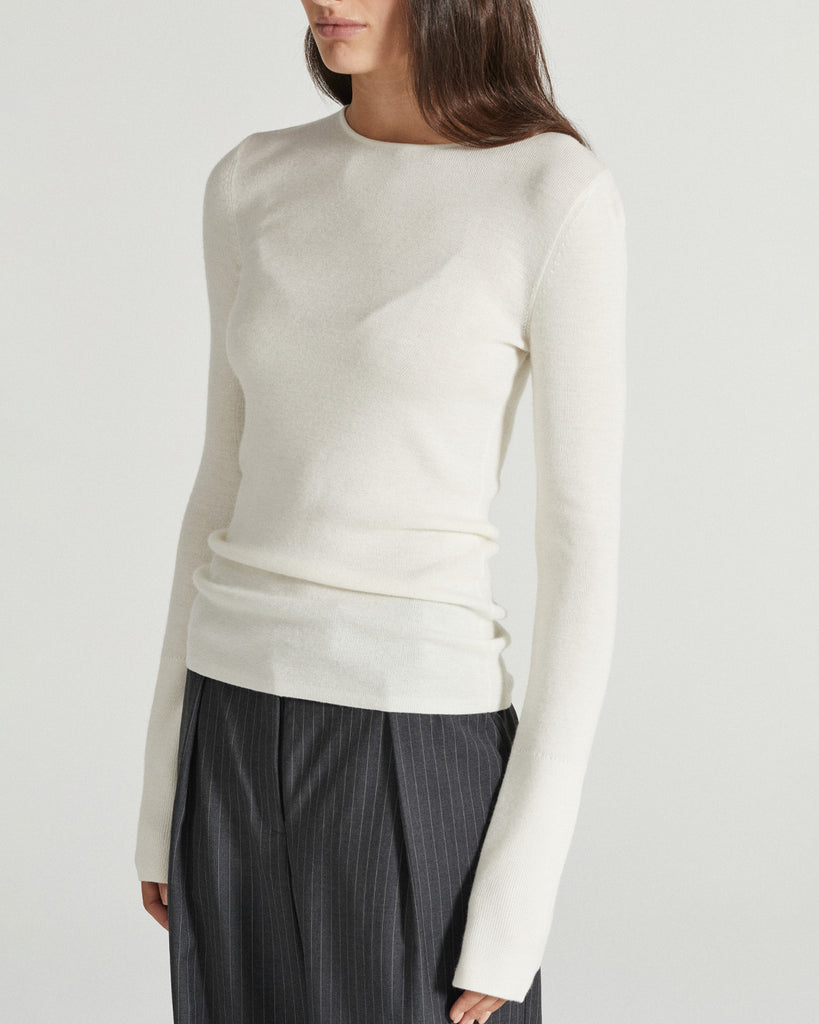 The ultimate luxury basic, the Sienna Top is a long-sleeve top made a dense-knit superfine merino fabrication. Beautifully soft and gentle on the skin, this knit is finished with subtle design details to elevate - including in seam split detailing on the sleeve cuffs and side splits over the hip. By Friends With Frank, now available at After Eight.