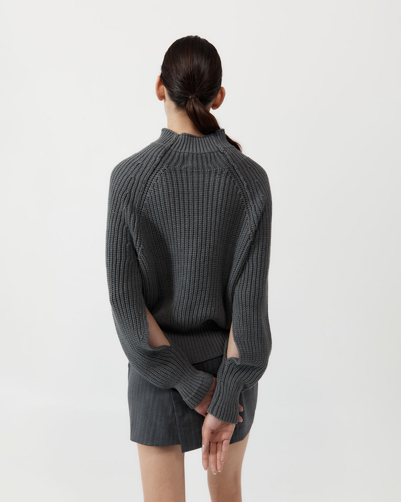 The perfect chunky sweater for the minimalist capsule wardrobe. Boasting a ribbed knit, mock neck and split sleeve detail, the Split Sleeve Jumper is spun from 100% organic cotton for a weighty, cosy hand feel. Ideal for trans-seasonal layering, the Split Sleeve Jumper is this season's cool-weather must-have. By St Agni, now available at After Eight. 