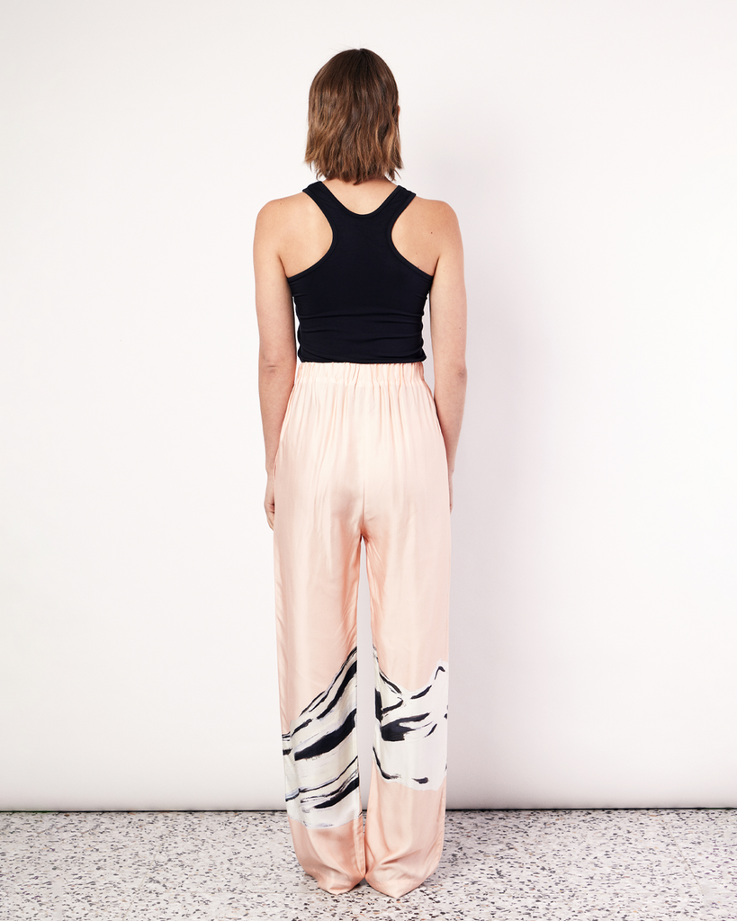 In collaboration with Tasmanian artist, Shelley Bickerstaff, Romy explored evocations and resonances of the female form in artwork exclusive to ROMY. Delicately placed on their signature style, the Hip Hills Pant features an elasticated waist and side pockets for an elevated yet comfortable style. By Romy, now available at After Eight. 