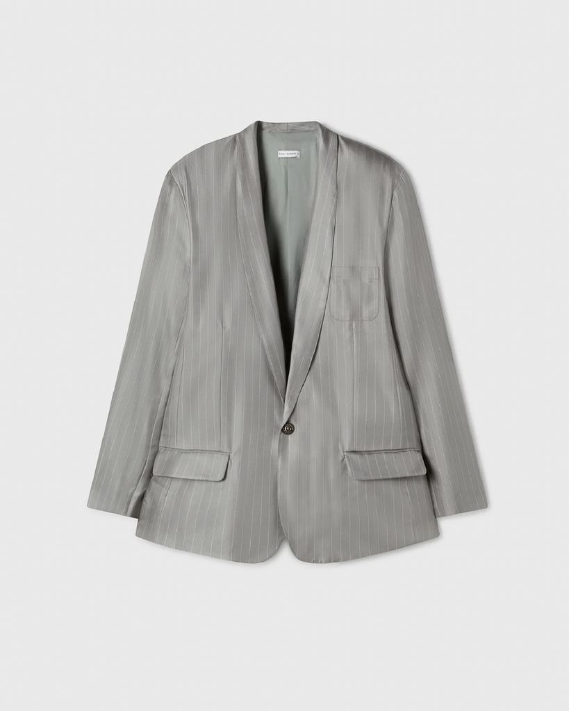 The Twill Miami Blazer features a luxurious silk, in a twill weave and a contemporary cut. This blazer hosts a sharp shawl collar, a single button closure, and welt pockets to give it all the elements of a classically tailored blazer. By Silk Laundry, now available at After Eight. 