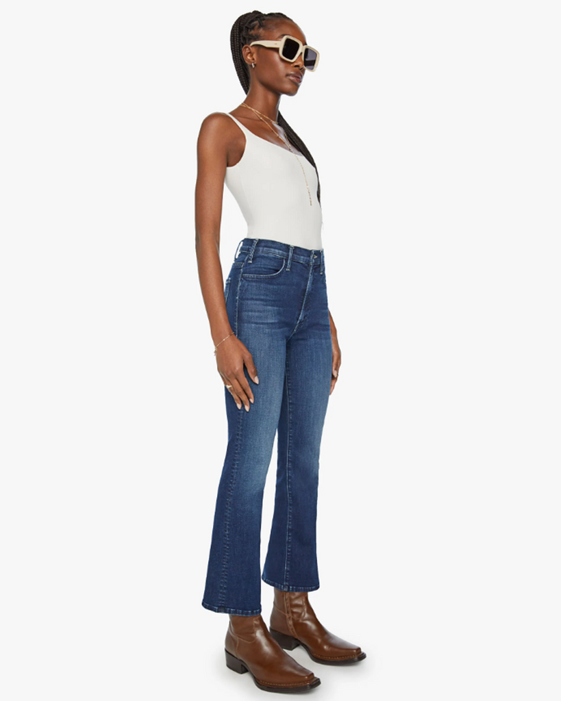 This high-rise flare has an ankle-length inseam and a clean hem. Cut from denim with a touch of stretch, Heirloom is a dark-blue wash with subtle whiskering and fading. Only the finest. By Mother Denim, now available at After Eight. 