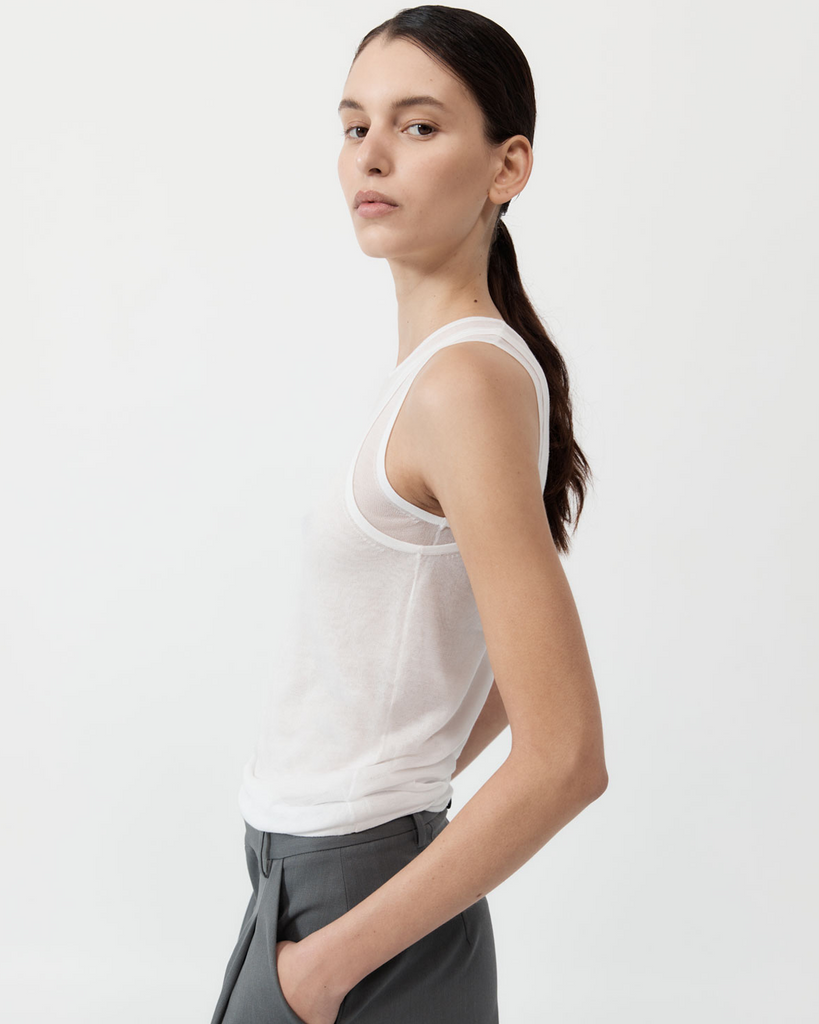 Playing with the versatility of creative layering, the Semi Sheer Double Layer Tank boasts a 100% TENCEL™ Lyocell construction for a semi-sheer, diaphanous look. Boasting a layered neckline, sleeveless tank silhouette and layered feature, The Semi Sheer Double Layer Tank is a playful reimagining of St Agni's signature, minimalist style. By St Agni, now available at After Eight. 