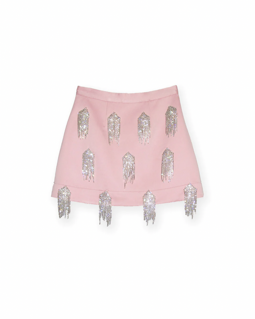 The Bloom Mini Skirt is a must-have addition to your wardrobe. Crafted from luxuriously heavy satin, it features Kourh signature crystals for a sophisticated yet stylish look. By Kourh, now available at After Eight. 