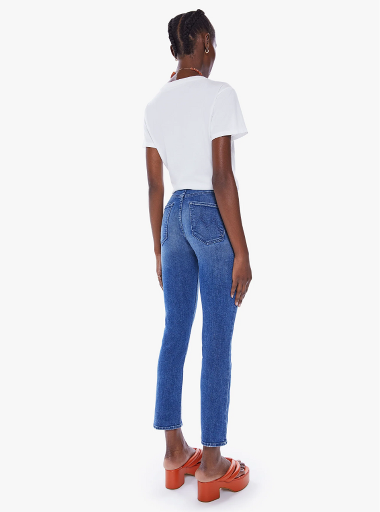 The most popular mid-rise straight leg hits at the ankle with a clean hem. Cut from stretch denim, Wish On A Star is a mid-blue wash with whiskering and fading at the knees. By Mother Denim, now available at After Eight. 