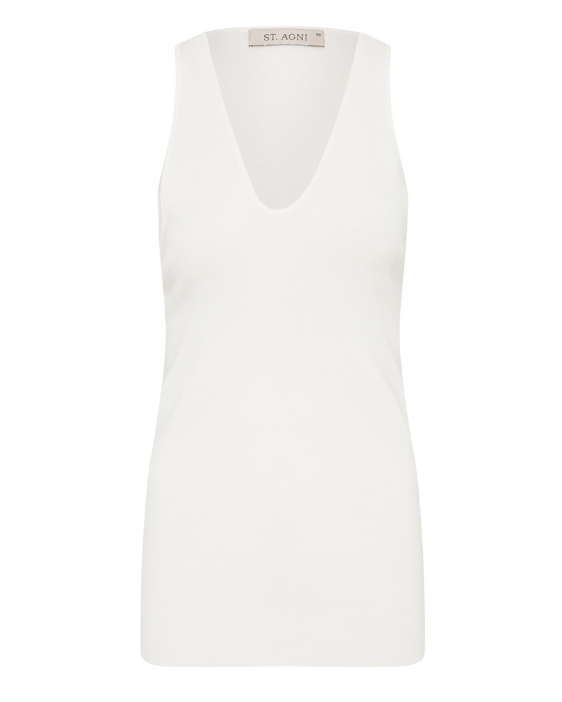 An easy and elevated everyday essential. The Plunge Neck Top features a scoop neckline, racerback, tank silhouette and hip length. Crafted from St. Agni's signature Tencel blend, the Plunge Neck Top boasts a fitted silhouette for a relaxed yet refined everyday essential. By St Agni, now available at After Eight. 