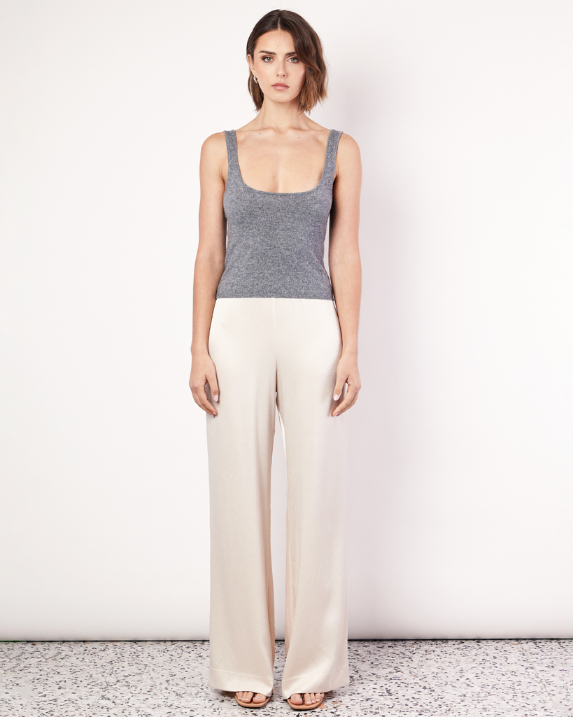 The Knit Tank is an elevated everyday wardrobe essential. Crafted from a soft Cashmere blend, this lightweight tank features scoop neck and cropped hem. By Romy, now available at After Eight. 