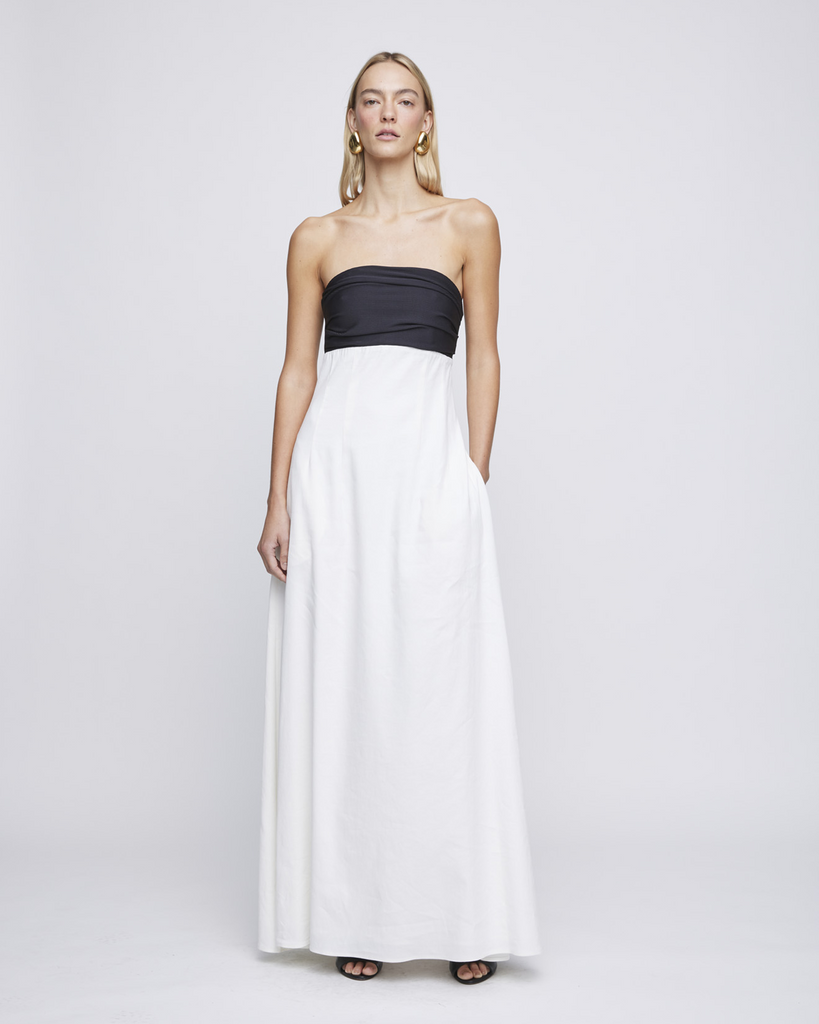 Crafted in a subtle combination of jersey stretch and ivory linen sourced from italy, The Marcia Dress is cut in an empire line midi style. Featuring a ruched jersey bust, the Marcia not only provides comfort but also style for a summer day time event. Fully lined and closed by a side zip. By Anna Quan, now available at After Eight. 