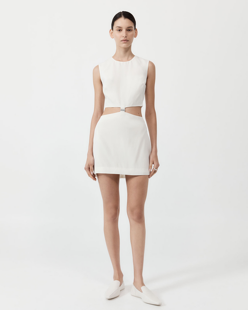 The Clip Buckle Mini Dress is a contemporary take on a classic mini. Boasting a cut-out waist, waist buckle detail and mini, fitted silhouette, the Clip Buckle Mini Dress is crafted from St. Agni’s signature responsibly sourced 100% viscose will. Made for those who dare to bare, the Clip Buckle Mini Dress is a bold staple. By St Agni, now available at After Eight. 