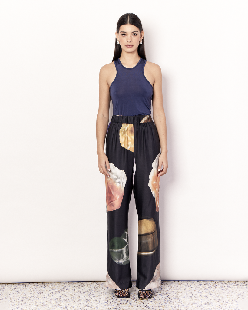 The Gemstone Pant features an elastic waistband and side pockets in our signature relaxed straight leg pant silhouette, offering an elevated yet comfortable style. It is crafted from a silky recycled Oeko-Tex® certified viscose in the opulent Gemstone Print, designed exclusively for Romy. Print placement will vary. By Romy, now available at After Eight. 