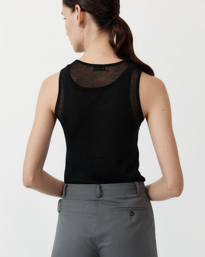 Playing with the versatility of creative layering, the Semi Sheer Double Layer Tank boasts a 100% TENCEL™ Lyocell construction for a semi-sheer, diaphanous look. Boasting a layered neckline, sleeveless tank silhouette and layered feature, The Semi Sheer Double Layer Tank is a playful reimagining of St Agni's signature, minimalist style. By St Agni, now available at After Eight. 