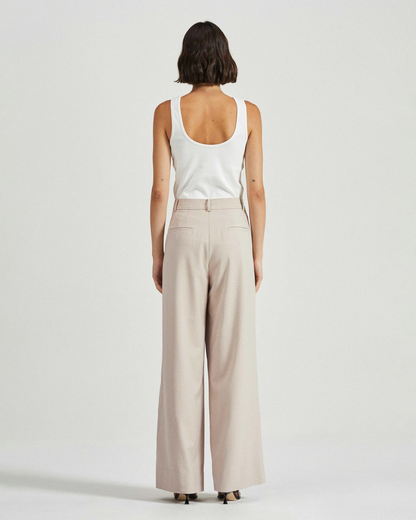 Expertly tailored from a lightweight tencel-wool blend, the Sabine Trousers feature double inverted pleating at the front, falling into a wide slouchy leg silhouette. The epitome of relaxed suiting, pair the Sabine Trousers with the co-ordinating blazer for the full look. By Friends with Frank, now available at After Eight. 