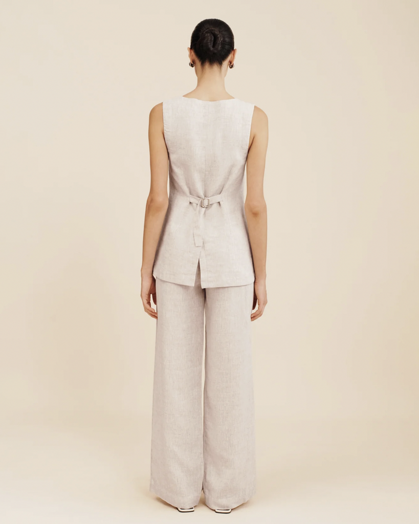 The Presley Trousers are cut from certified linen and are designed with a high-rise waist. They feature roomy, wide legs and front pleats to create volume. Wear yours as a set with the matching Emma Vest or pair them with a simple tank and slides. By Posse, now available at After Eight. 