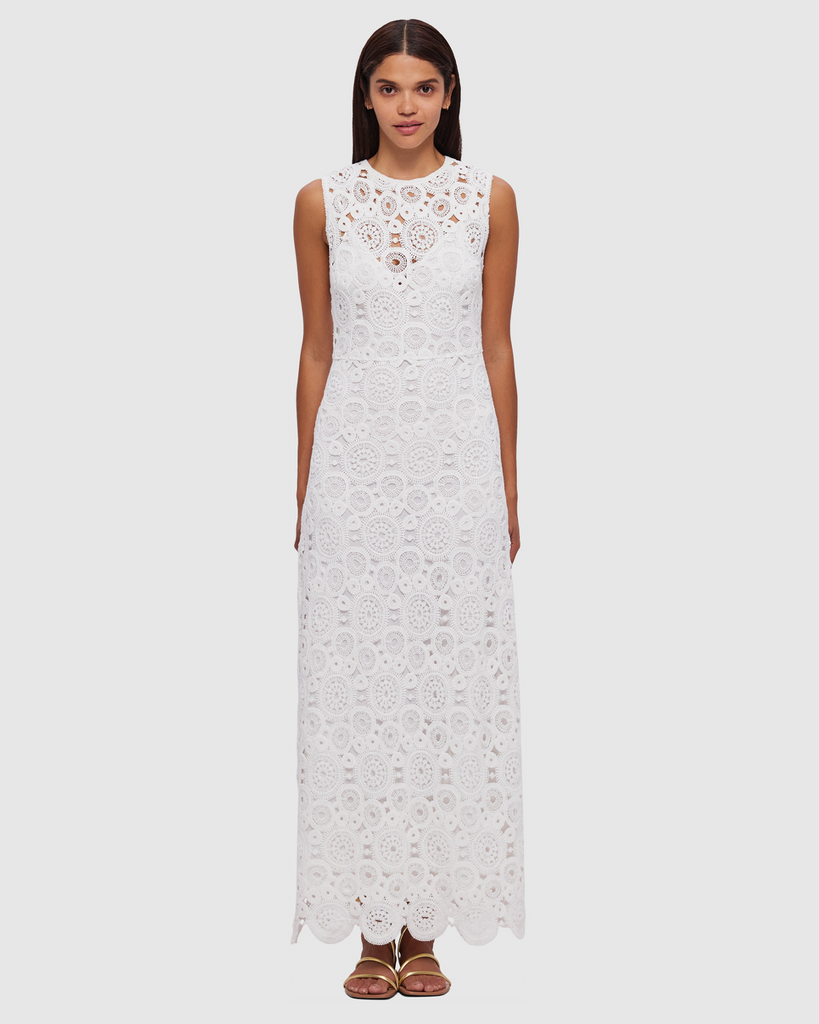 Elevate your style with the Serena Crochet Midi Dress in Snow from LEO LIN—a timeless piece that effortlessly radiates elegance. This premium crochet midi dress features a round neckline, sleeveless design, and a fitted silhouette for a chic look. The invisible back zip closure ensures a seamless finish, while the scallop edge hemline adds a touch of luxury. Included with the dress is a matching slip dress, completing the ensemble. By Leo Lin, now available at After Eight. 