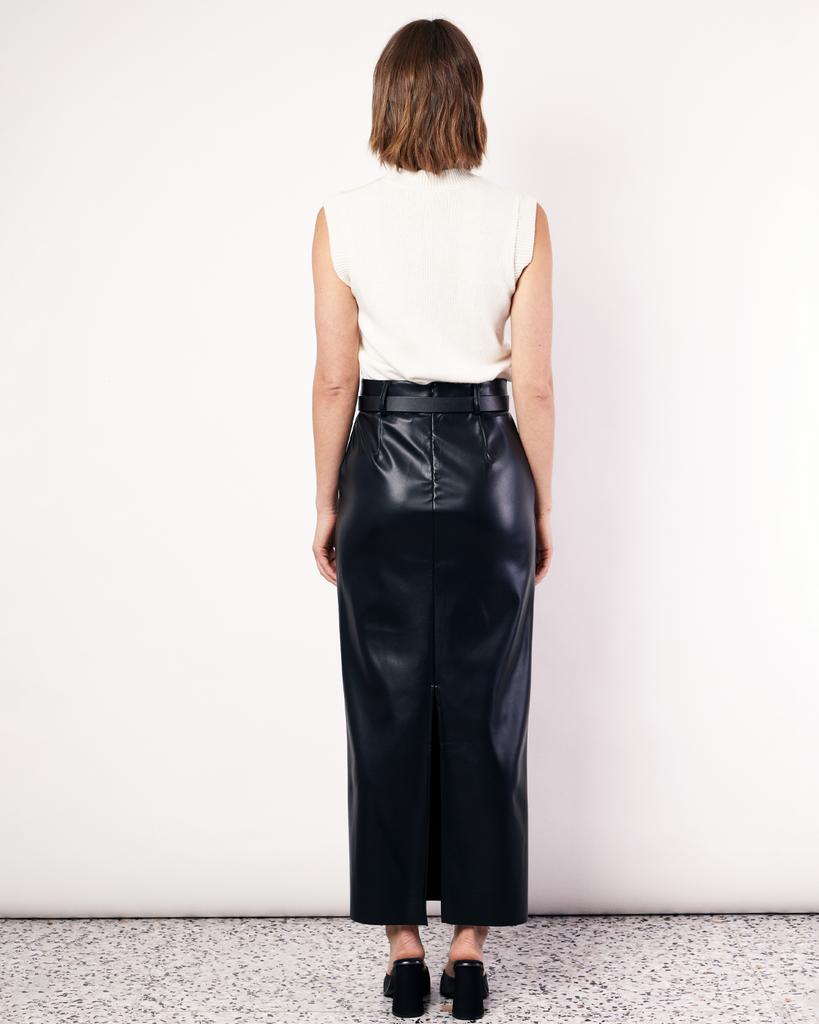 The best selling, Maxi Suiting Skirt has been recut for Fall in a buttery soft vegan leather. It features belt loops and a back split for ease of wear. By Romy, now available at After Eight.