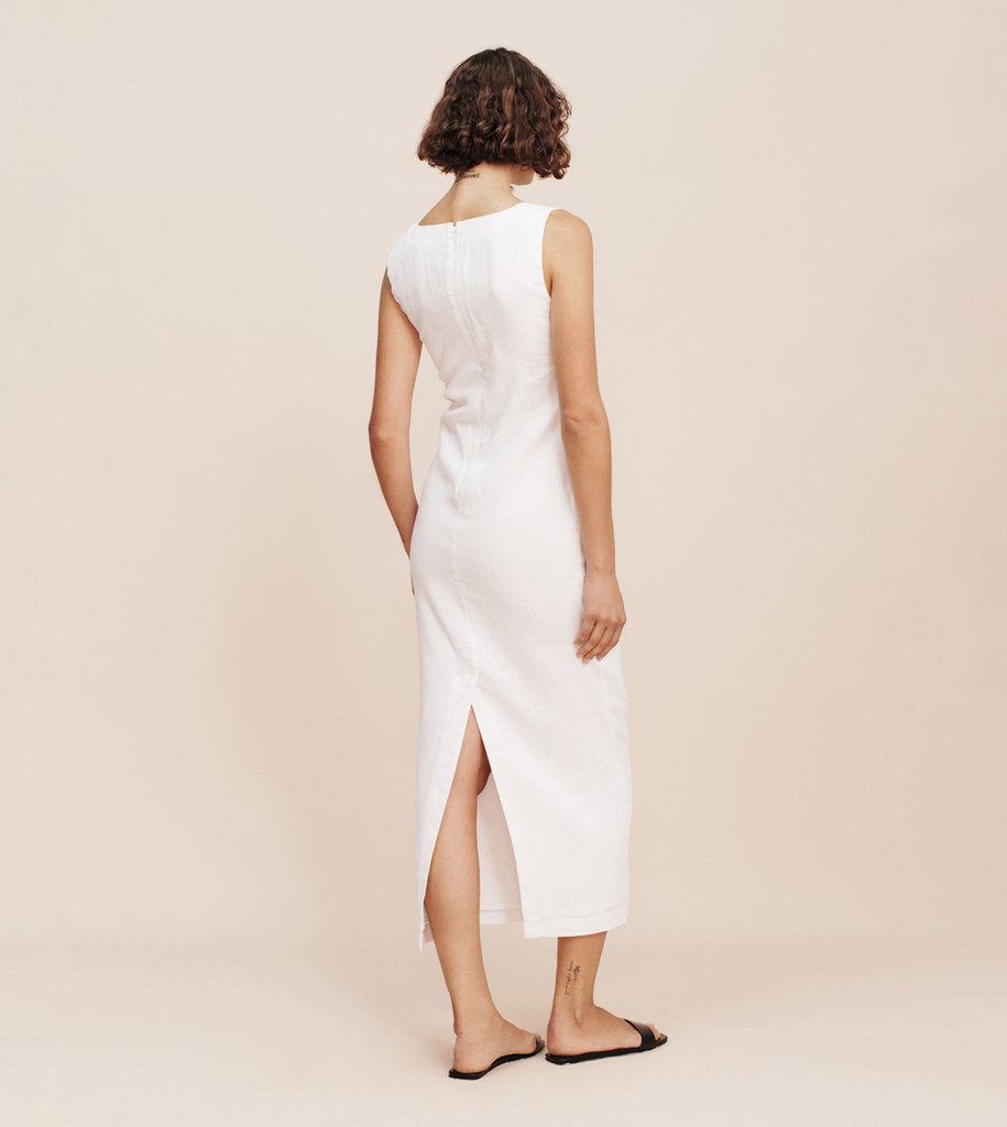 The Alice Midi Dress embodies effortless elegance like no other. Cut from the signature Posse linen, it features a flattering square neckline, wide straps and has a subtle split at the back. A classic wardrobe staple that works for both day and night. By Posse, now available at After Eight. 