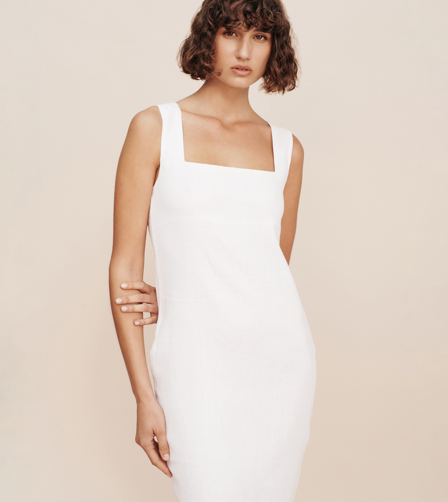 The Alice Midi Dress embodies effortless elegance like no other. Cut from the signature Posse linen, it features a flattering square neckline, wide straps and has a subtle split at the back. A classic wardrobe staple that works for both day and night. By Posse, now available at After Eight. 