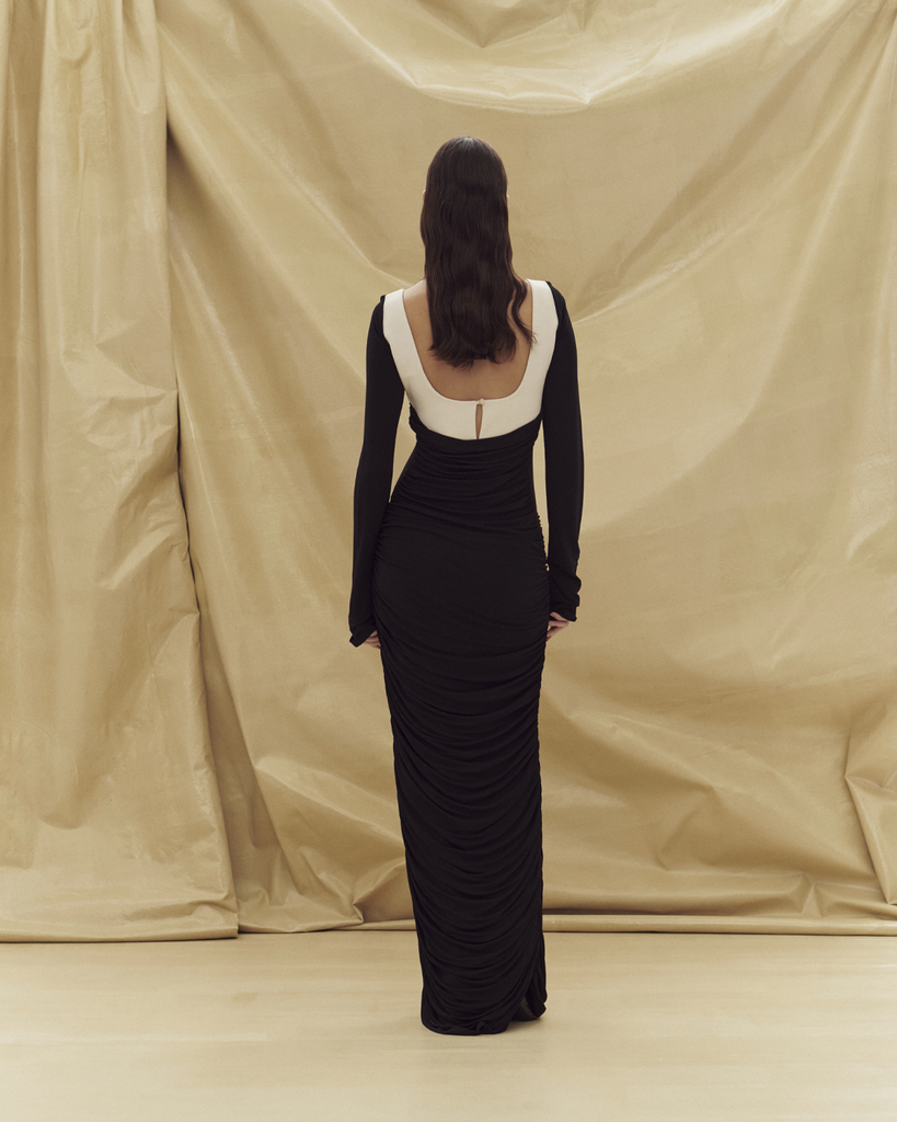 The Talullah Dress is a slinky knit, full length gown with long sleeves and beautiful cream detailing. By Paris Georgia, now available at After Eight. 