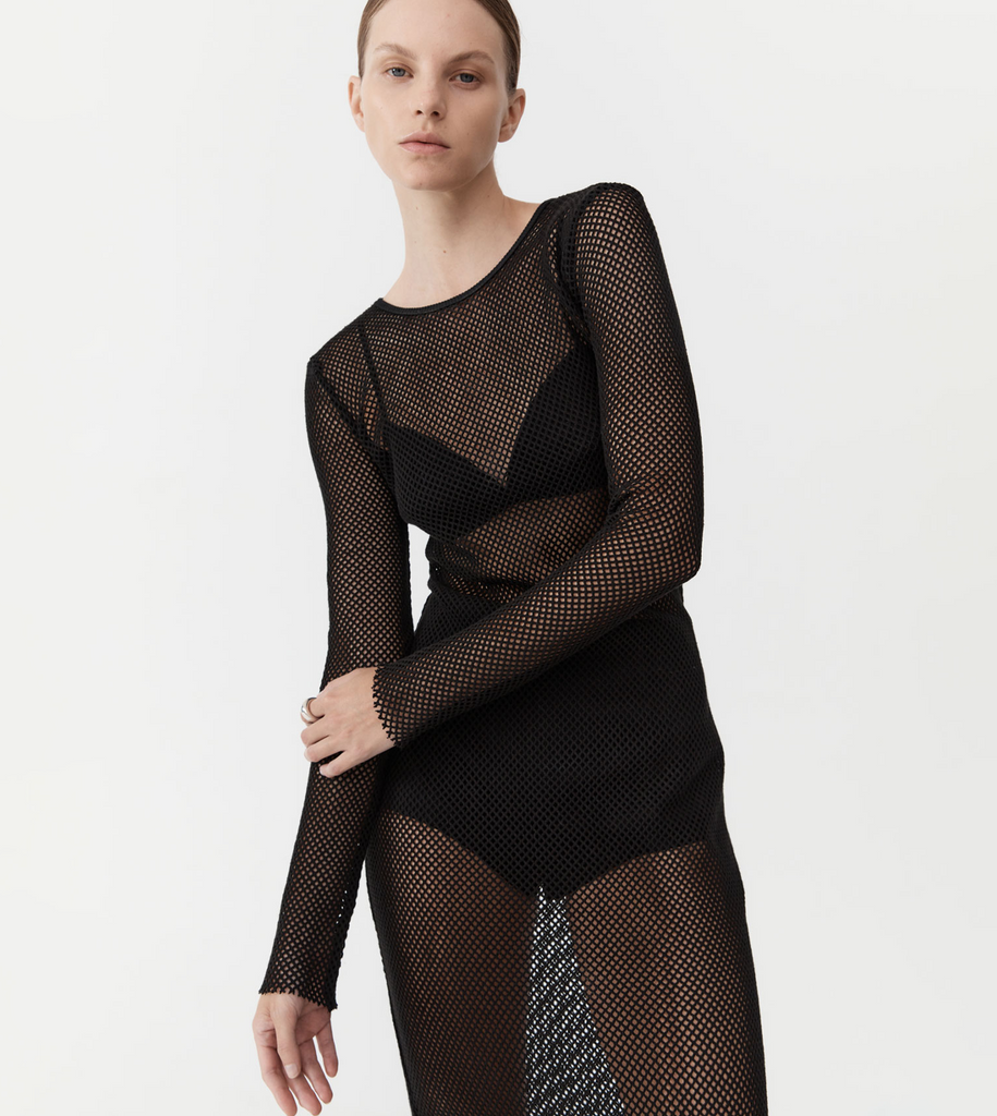 The Mesh Long Sleeve Dress is crafted from a 100% cotton mesh boasting a semi-fitted silhouette, maxi length, raw hems and crew neckline. Designed to be attention-calling while maintaining an air of elegance and timelessness, the Mesh Long Sleeve Dress combines a minimalist ethos with a touch of the avant-garde. By St Agni, now available at After Eight.