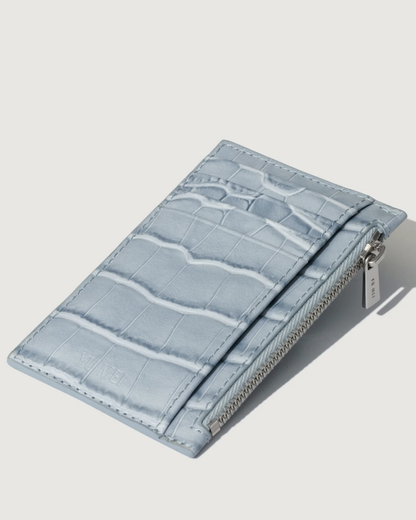 The swiss army knife of the wallet world, the Frank Cardholder carries only the essentials, slips discreetly into a pocket, and is suitably equipped for anything. Rendered in premium Croc-Embossed cowhide. By Yu Mei, now available at After Eight. 