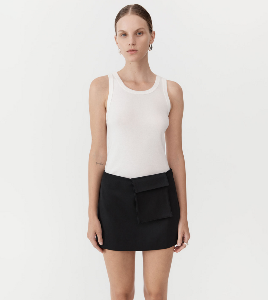 A playful update to a classic silhouette, the Utilitarian Pocket Mini Skirt is crafted from the St Agni signature responsibly sourced wool blend. Boasting a low waist, detachable pocket and slim fit, the Utilitarian Pocket Mini Skirt combines the best of multi-way dressing. By St Agni, now available at After Eight. 