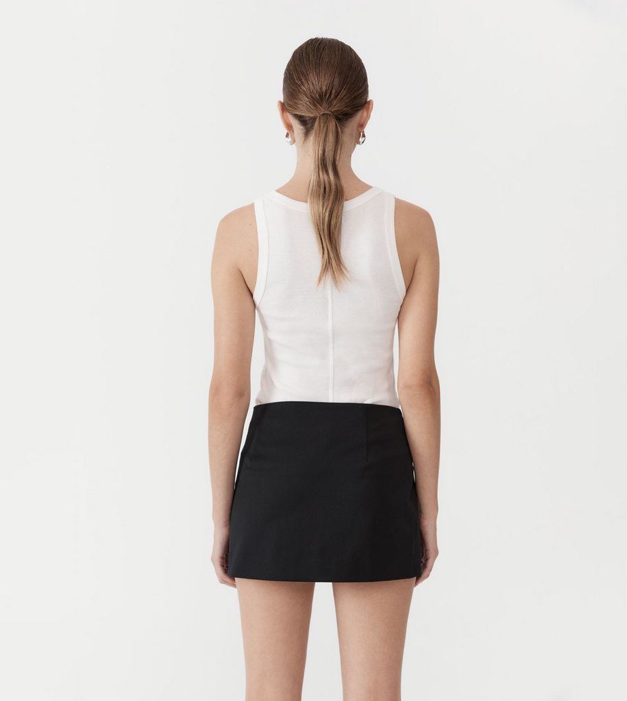 A playful update to a classic silhouette, the Utilitarian Pocket Mini Skirt is crafted from the St Agni signature responsibly sourced wool blend. Boasting a low waist, detachable pocket and slim fit, the Utilitarian Pocket Mini Skirt combines the best of multi-way dressing. By St Agni, now available at After Eight. 