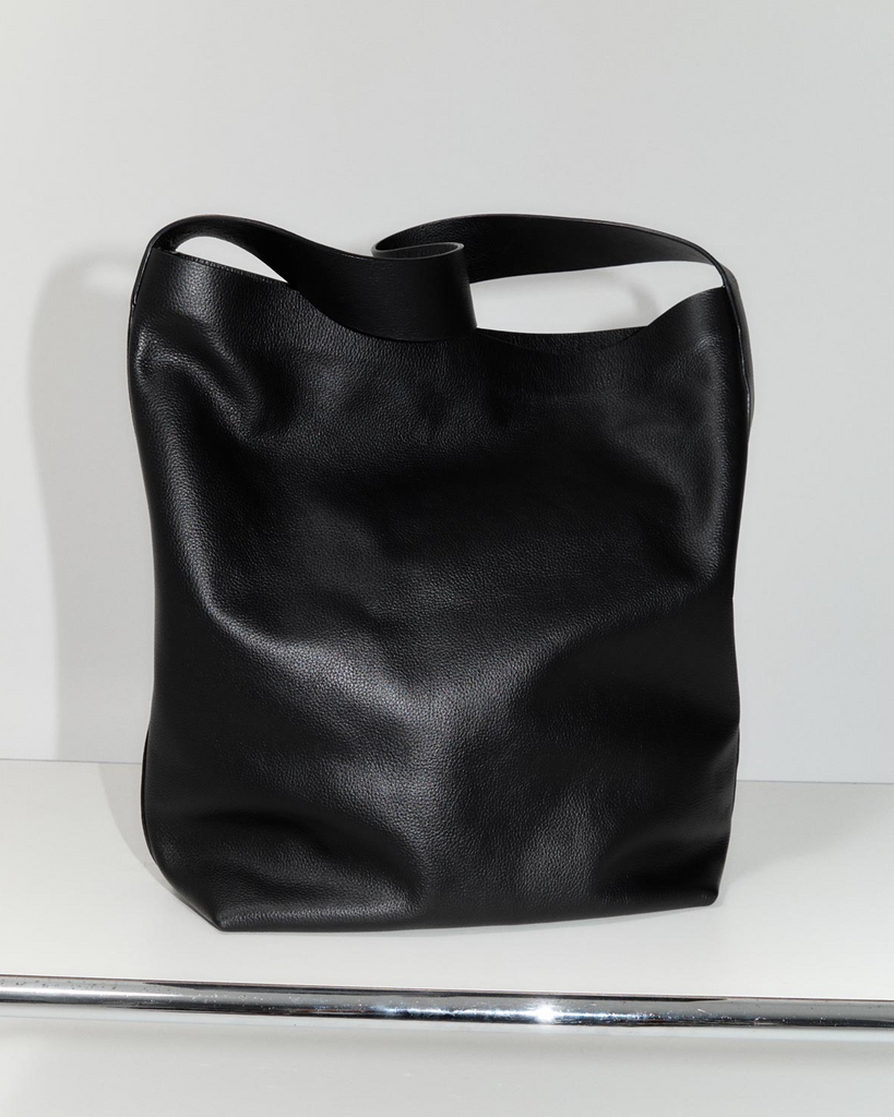 A nod to St Agni's origins, the Minimal Everyday Bag is a refined and unadorned everyday essential. Boasting a large body, minimalist silhouette and magnet closure, the Minimal Everyday Bag is a throw-on-and-go tote that's large enough to fit both work and play. By St Agni, now available at After Eight. 