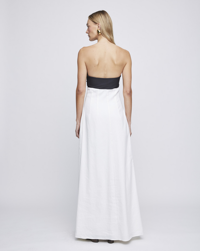 Crafted in a subtle combination of jersey stretch and ivory linen sourced from italy, The Marcia Dress is cut in an empire line midi style. Featuring a ruched jersey bust, the Marcia not only provides comfort but also style for a summer day time event. Fully lined and closed by a side zip. By Anna Quan, now available at After Eight. 