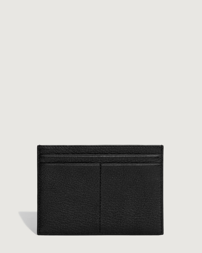 Youhan is a meticulously groomed city slicker. This large-format cardholder features four regular card slots and three larger compartments to discreetly house a passport and some metro cards. By Yu Mei, now available at After Eight. 