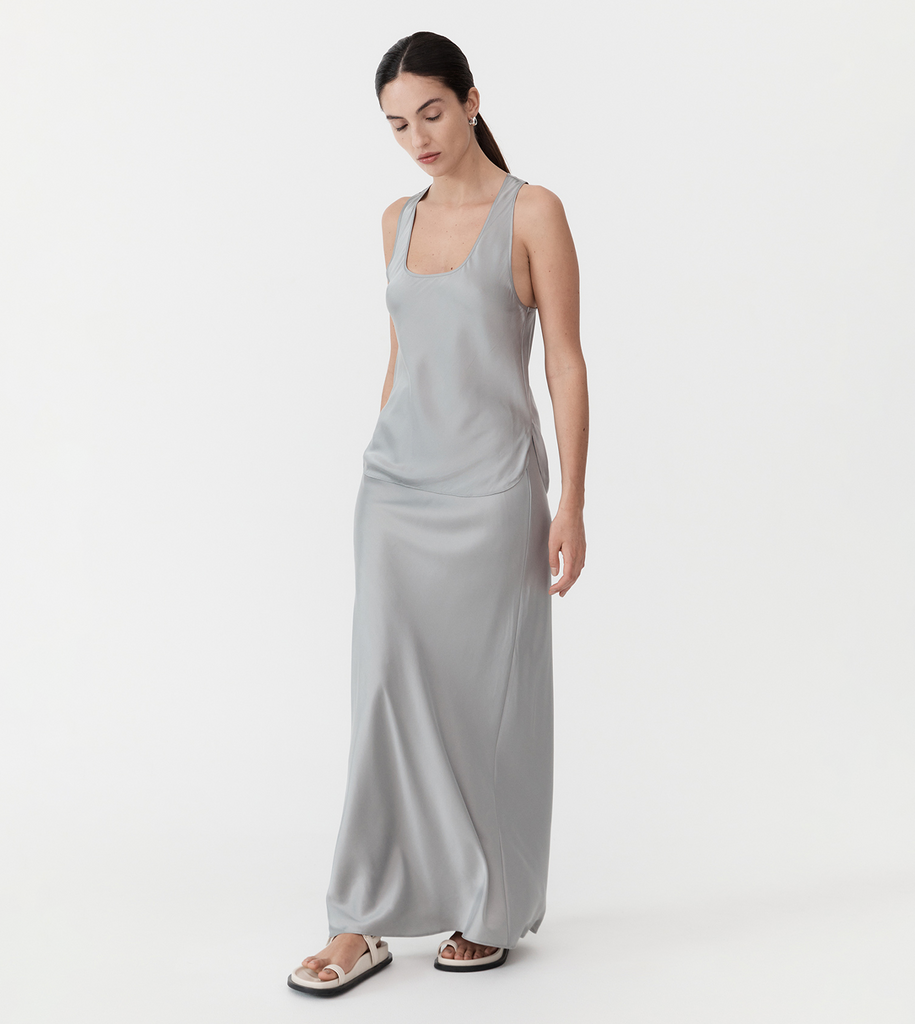 A sleek, slip-on-and-go number to dress up or down for daily wear. Boasting a racer-back style, curved hem with side splits, scooped U-neckline and crafted from the St Agni signature silk blend, the Racer Back Bias Tank is ideal for minimalist style with maximal impact. By St Agni, now available at After Eight. 