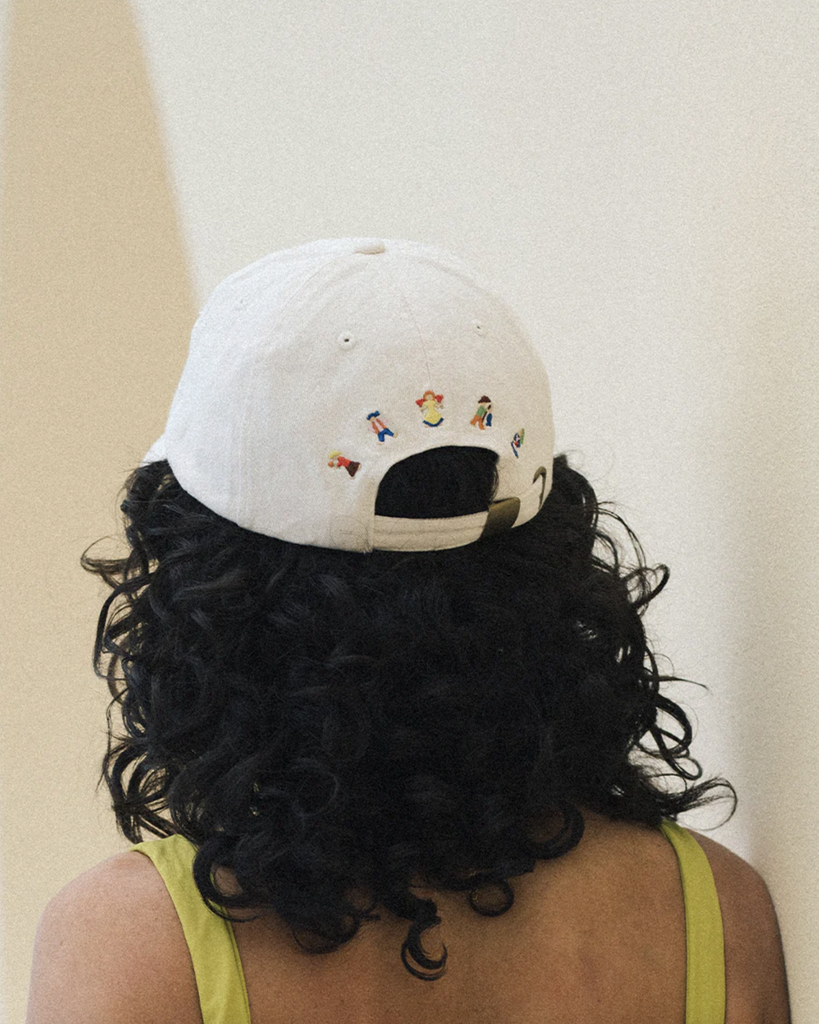 Unstructured, low-crown ‘dad cap’ style with embroidered "chiquita" (Spanish for "Little Lady") on front, and Fellow motif design on back. Proudly made from 100% recycled cotton. By Soleil Soleil, available at After Eight. 