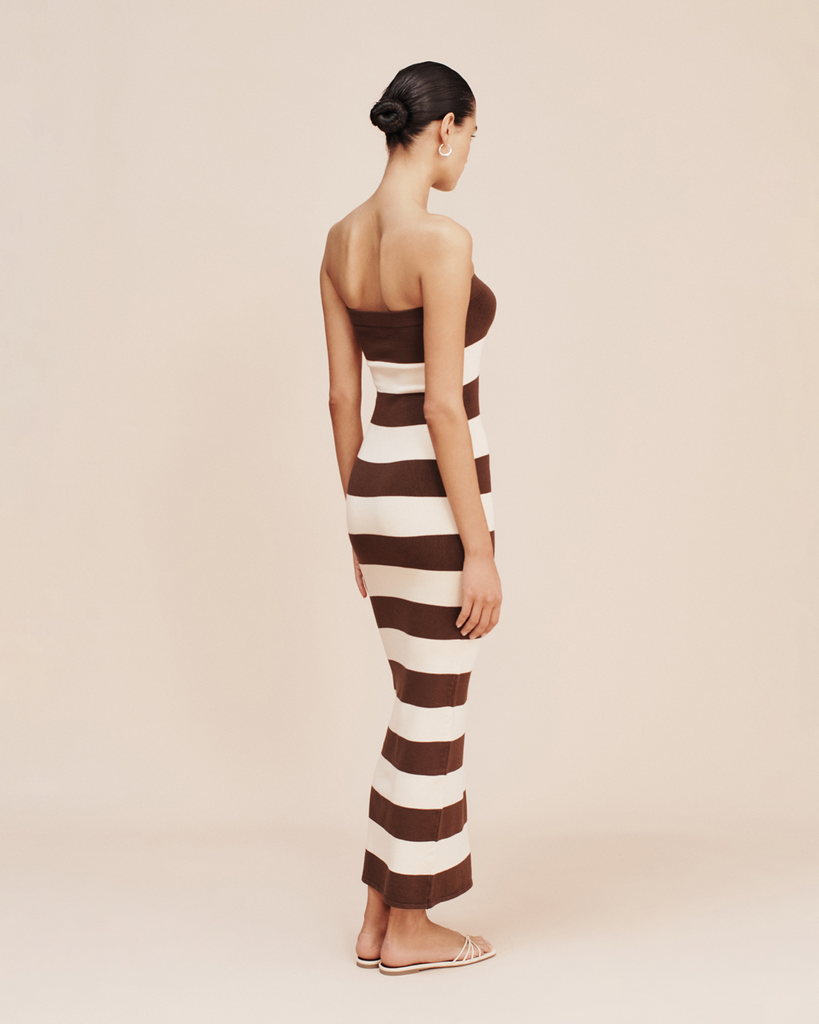 The Theo Dress has a strapless silhouette thats both elegant and timeless. It's patterned with classic chocolate and cream stripes and is designed for a close, figure-hugging fit. By Posse, now available at After Eight. 