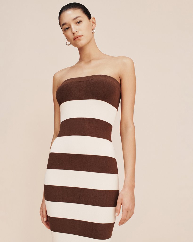 The Theo Dress has a strapless silhouette thats both elegant and timeless. It's patterned with classic chocolate and cream stripes and is designed for a close, figure-hugging fit. By Posse, now available at After Eight. 