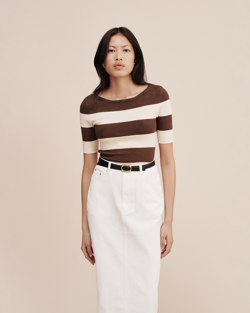 The Theo Top has an elegant high neckline and is patterned with classic chocolate and cream stripes. It's cut from stretch-knit and is designed for a close fit. Style yours with high-rise denim. By Posse, now available at After Eight. 