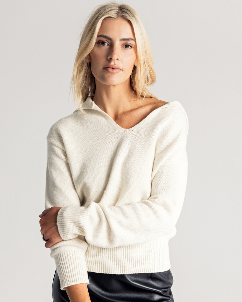 The Relaxed Collared Sweater is a luxurious testament to both warmth and style, expertly crafted from a sumptuous wool and cashmere blend. Designed for a relaxed fit, its oversized silhouette drapes effortlessly, embracing comfort without compromising on chic sophistication.